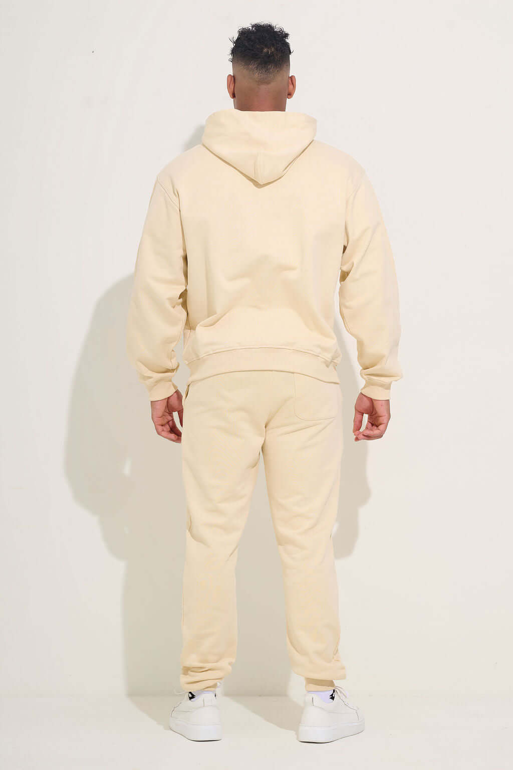 Back view showing the hood and straight cut through the hem - KAVEON