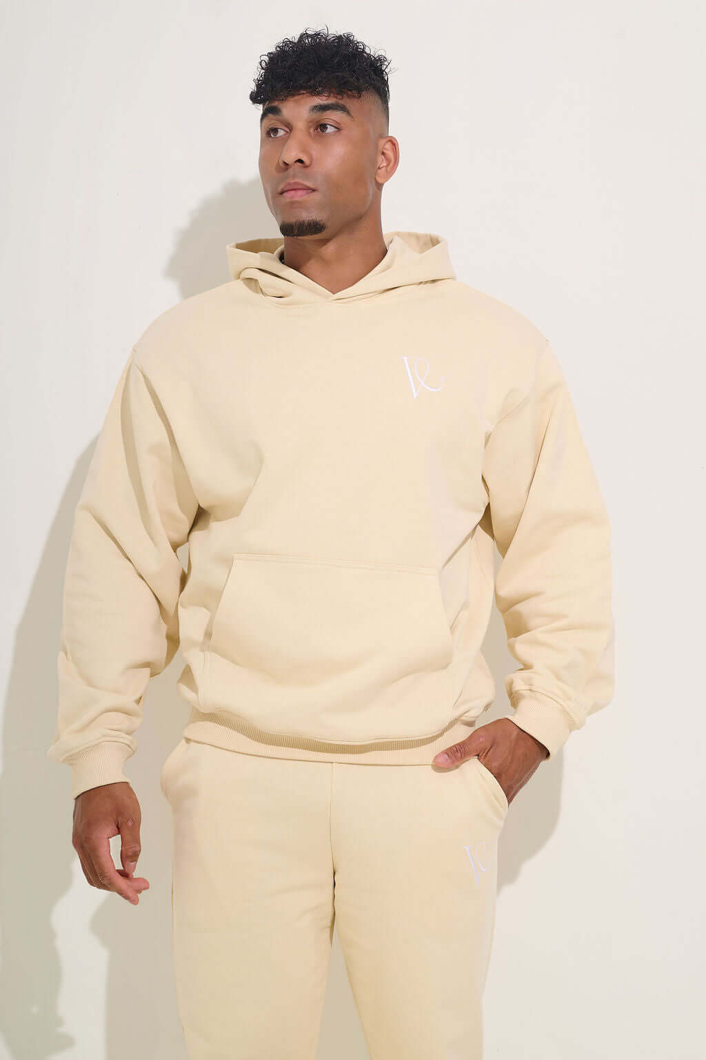 Front view showing the kangaroo pocket, hood and dropped shoulder seam - KAVEON